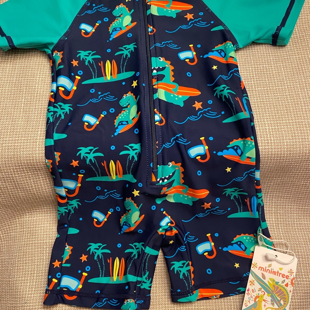 One-Piece Swim Suit, Green with dinosaur print, Size 18-24 Months.